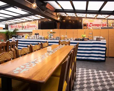 a long wooden table and chairs in a restaurant at Hotel Scherman in New York