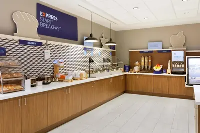 a fast food restaurant with a counter with food at Holiday Inn Express and Suites Limerick - Pottstown by IHG in Limerick