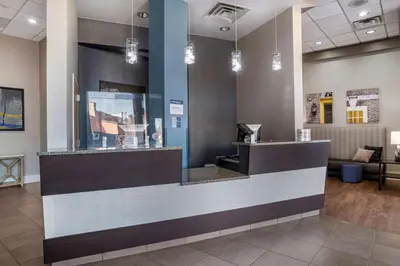 a lobby of a waiting room with a counter at Best Western Plus Philadelphia Airport South - at Widener University in Chester