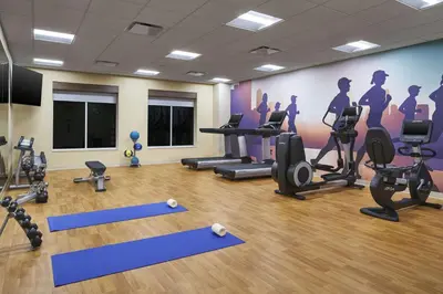 a gym with pilates equipment in a room at Hyatt Place Wilmington Riverfront in Wilmington