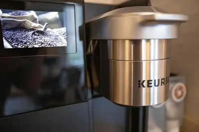 a coffee pot on top of a microwave oven at The Conwell Inn in Philadelphia
