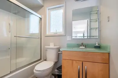 a bathroom with a toilet and a shower and a sink at Cobalt in Lake Harmony