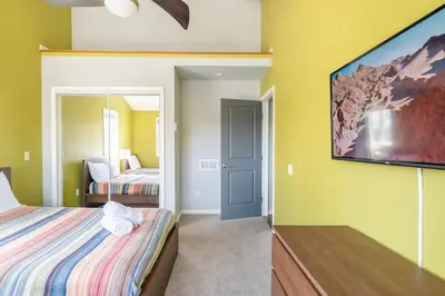 a bedroom with a bed and a flat screen tv at Cobalt in Lake Harmony