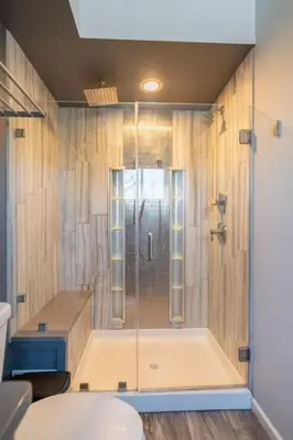 a bathroom with a shower and a toilet at Cobalt in Lake Harmony
