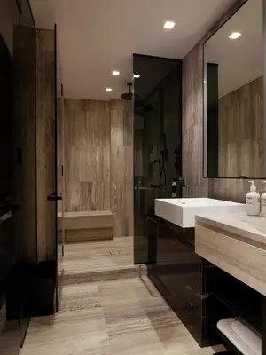 a bathroom with a tub and a sink and a shower at Equinox Hotel New York in New York