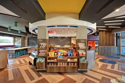 a grocery store with a display of products at Tru By Hilton Denver, PA in Denver