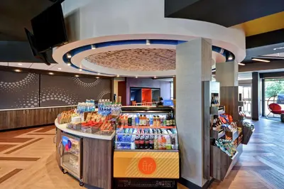 a store with a counter with drinks on it at Tru By Hilton Denver, PA in Denver