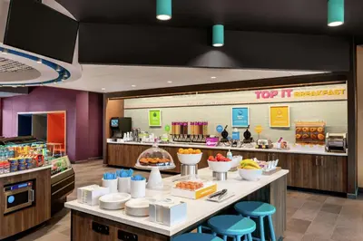 a fast food restaurant with a buffet of food at Tru By Hilton Hershey Chocolate Avenue in Hershey