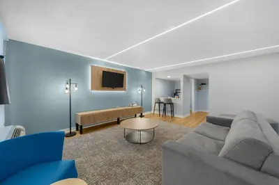 a living room with a couch and a table at Radisson Hotel Philadelphia Northeast in Trevose