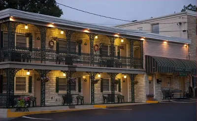 a building with a balcony on the side of it at Simmons Motel and Suites in Hershey