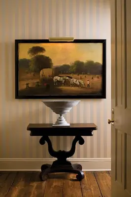a painting of horses in a field on a wall at Hotel Fauchere in Milford