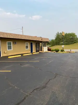 an empty parking lot in front of a building at Dunmore Inn in Dunmore