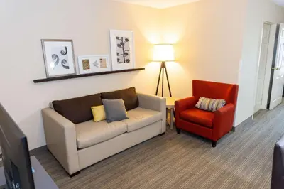 a living room with a couch and a chair at Country Inn & Suites by Radisson, Lehighton-Jim Thorpe, PA in Lehighton