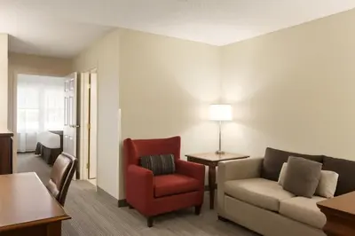 a living room with a couch and a chair at Country Inn & Suites by Radisson, Lehighton-Jim Thorpe, PA in Lehighton