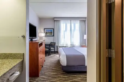 a hotel room with a bed and a television at Best Western Lock Haven in Lock Haven
