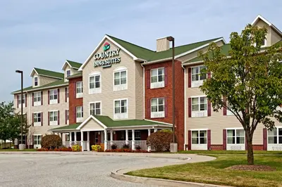 a large building with a sign on the front of it at Country Inn & Suites by Radisson, York, PA in York