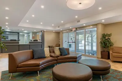 a living room with a couch and a table at Candlewood Suites Reading by IHG in Reading