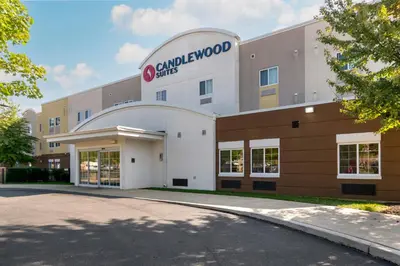 a building with a camel wood studios sign on it at Candlewood Suites Reading by IHG in Reading