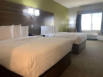 a hotel room with two beds and a window at Best Western Plus Horseheads - Elmira in Horseheads