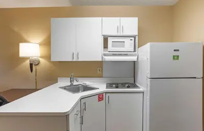 a kitchen with a white refrigerator and a microwave at Extended Stay America Suites - Philadelphia - Mt Laurel - Crawford Place in Mount Laurel