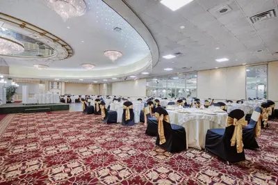 a banquet hall with tables with people sitting at them at Best Western Plus Wilkes Barre Center City in Wilkes-Barre
