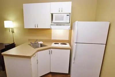 a kitchen with a white refrigerator and a sink at Extended Stay America Suites - Philadelphia - Cherry Hill in Maple Shade