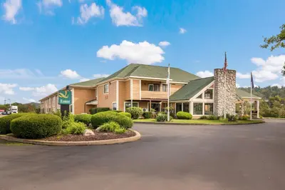 a building with a parking lot in front of it at Quality Inn Bloomsburg in Bloomsburg