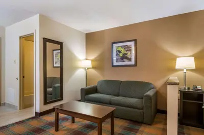 a living room with a couch and a table at Quality Inn Bloomsburg in Bloomsburg