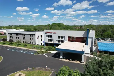 an aerial view of a hotel with a parking lot at Hampton Inn Flemington in Flemington