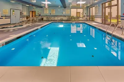 a large swimming pool with blue water at Hampton Inn Flemington in Flemington