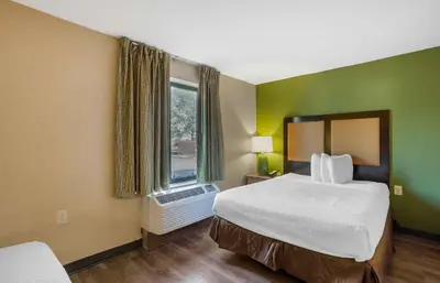 a hotel room with a bed and a window at Extended Stay America Suites - Philadelphia - Airport - Bartram Ave in Philadelphia