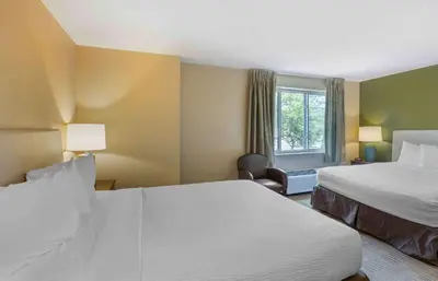 a hotel room with two beds and a window at Extended Stay America Suites - Philadelphia - Mt Laurel - Pacilli Place in Mount Laurel
