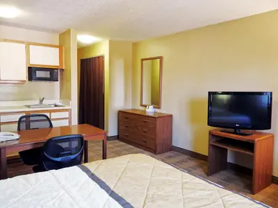 a hotel room with a bed and a desk and a television at Extended Stay America Suites - Philadelphia - Mt Laurel - Pacilli Place in Mount Laurel