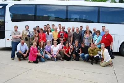 a group of people posing in front of a bus at Holiday Inn Express Bordentown - Trenton South by IHG in Bordentown
