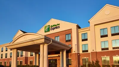 a hotel with a sign on the front of a building at Holiday Inn Express Bordentown - Trenton South by IHG in Bordentown