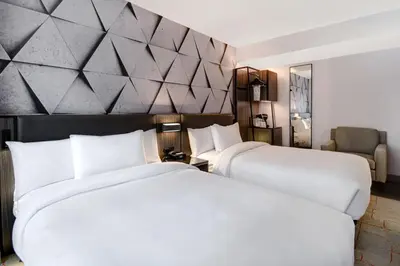 two beds sitting next to each other in a hotel room at SpringHill Suites by Marriott New York Midtown Manhattan/Park Ave in New York