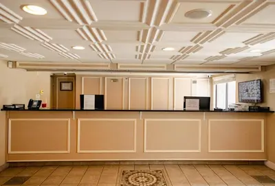 a large room with a counter in a building at Windsor Hotel in East Windsor