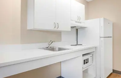 a white kitchen with a sink and a microwave at Extended Stay America Suites - Philadelphia - Bensalem in Bensalem