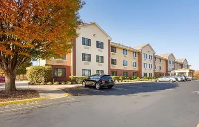 a car parked in a parking lot in front of a building at Extended Stay America Suites - Philadelphia - Bensalem in Bensalem