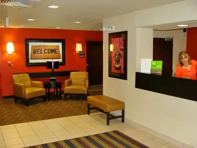 a waiting room with chairs and a television in a hospital at Extended Stay America Suites - Somerset - Franklin in Somerset