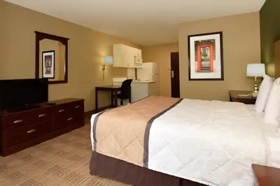 a hotel room with a bed and a television at Extended Stay America Select Suites - Philadelphia - Malvern - Great Valley in Malvern