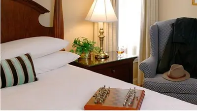 a tray of dominoes on a bed in a hotel room at Lambertville House in Lambertville