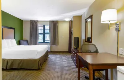a large hotel room with a bed and a desk at Extended Stay America Suites - Mt Olive - Budd Lake in Budd Lake