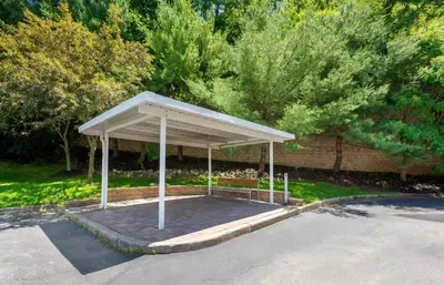a pavilion in a parking lot with trees in the background at Extended Stay America Suites - Mt Olive - Budd Lake in Budd Lake