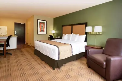 a bedroom with a bed and a desk and a chair at Extended Stay America Suites - Mt Olive - Budd Lake in Budd Lake