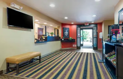 a waiting room at a hospital with a tv on a wall at Extended Stay America Suites - Mt Olive - Budd Lake in Budd Lake