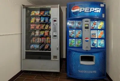 a pepsi vending machine next to a drink cooler at Red Roof Inn Mt Laurel in Mount Laurel