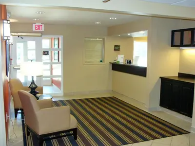 a lobby with a waiting room with chairs and a waiting area at Extended Stay America Suites - Piscataway - Rutgers University in Randolphville