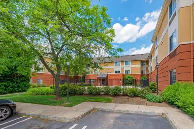 a parking lot in front of a building at Extended Stay America Suites - Piscataway - Rutgers University in Randolphville