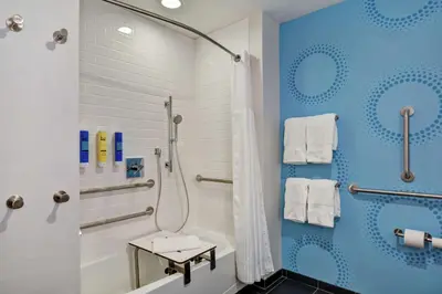 a bathroom with a shower and a toilet at Tru By Hilton Middletown in Middletown